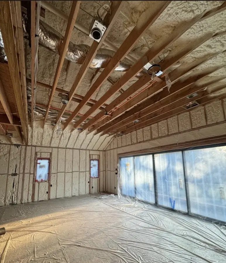 Interior walls and ceiling insulated with spray foam during new construction in Pound Ridge